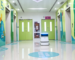 InterCon autonomous commercial cleaning robot scrubbing hospital hallway floors with anti-bacteria design.