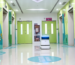 InterCon autonomous commercial cleaning robot scrubbing hospital hallway floors with anti-bacteria design.